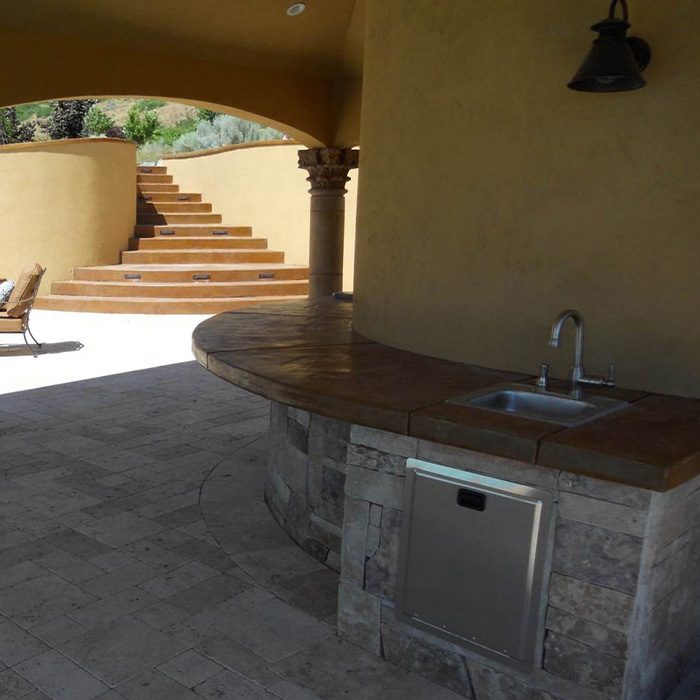 Outside concrete kitchen and steps